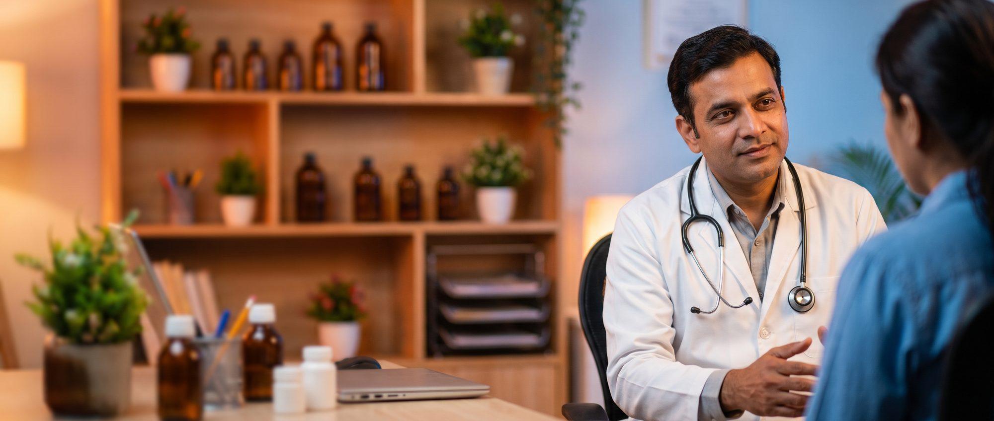 Homeopathy doctor attentively consulting with a patient